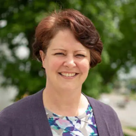 Anna Andrews smiling at camera