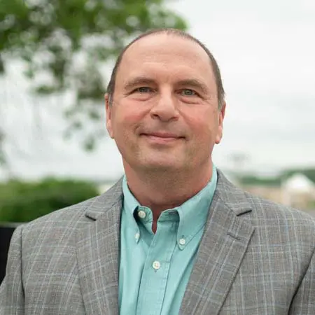 Dan King smiling at camera