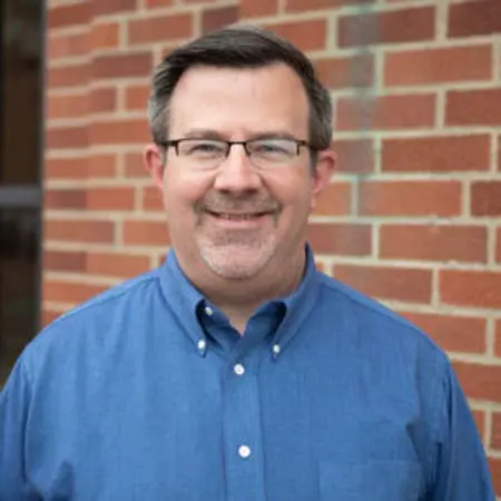 David Hicks smiling at camera