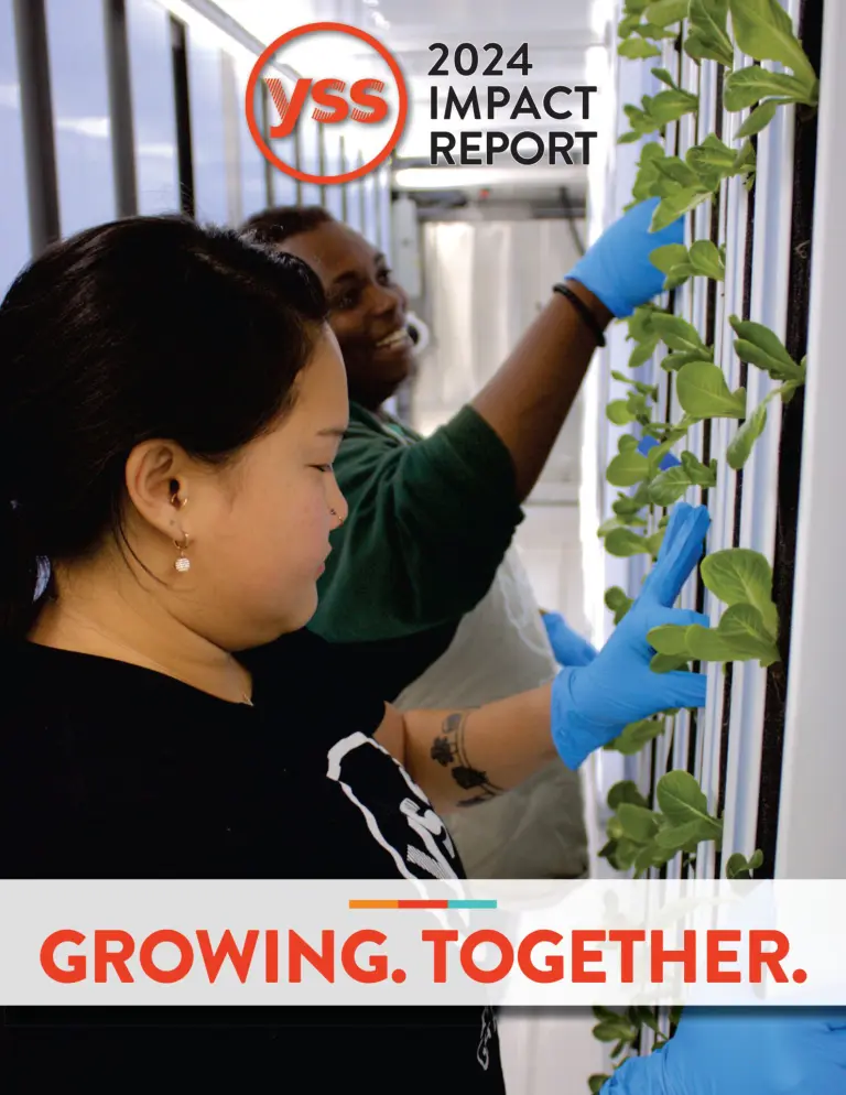 YSS impact report cover with a photo of two people working with plants.